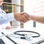 Professor Doctor having shaking hands with patient after recomme
